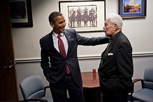 President Barack Obama reacts to Father Hesburgh's friendly advice before the start of Notre Dame's Commencement Ceremonies, May 2009