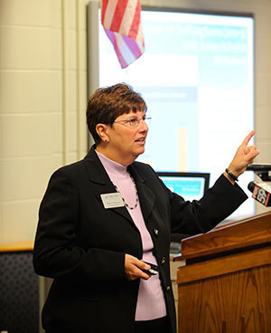 Karen Morris, program director for the AP-TIP IN program in the Institute for Educational Initiatives, presents statistics of the program’s first-year success at a news conference at Perry Meridian High School in Indianapolis
