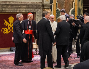 His Holiness Pope Francis shakes hands with members of the Board of Trustees