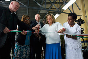 The following dignitaries from Haiti and Notre Dame cut a symbolic ribbon in celebration of the dedication of the new salt factory (L-R): Rev. Thomas Streit, founder and principal investigator of the Notre Dame Haiti Program; Dr. Florence Guillaume, the Haitian Minister for Public Health and Population (MSPP); Earl Carter, managing director of the Notre Dame Haiti Program; Sophia Martelly, the first lady of Haiti; and Joseline Marhone Pierre, director of the Office of Nutrition, MSPP