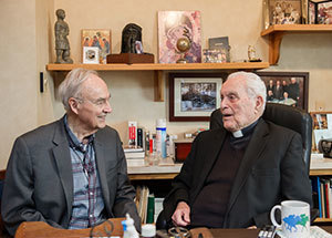 President Emeritus Rev. Theodore M. Hesburgh, C.S.C., meets with former Senator Harris Wofford