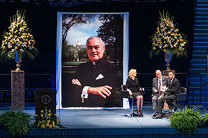 Emcee Anne Thompson chats with former Senator Harris Wofford and Notre Dame Board of Trustees member Martin W. Rodgers during a tribute ceremony in the Purcell Pavilion to honor the life of the late President Emeritus Rev. Theodore M. Hesburgh, C.S.C.
