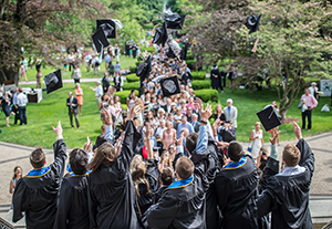 2015 graduates on the steps of the Main Building