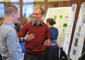 Student researcher Kyle Cowdrick presents at the 2014 Harper Cancer Research Day
