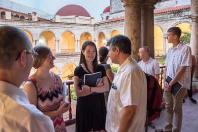 Peter Casarella, director of Latin American/North American Church Concerns, speaks with undergraduate students after the opening session of a colloquium in Cuba which initiated a three-year study, led by Casarella, of Pope Francis’ “Teologia del Pueblo” (Theology of the People).