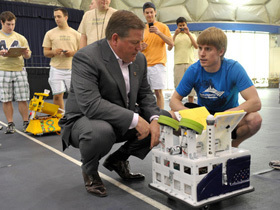 Coach Kelly with robot football
