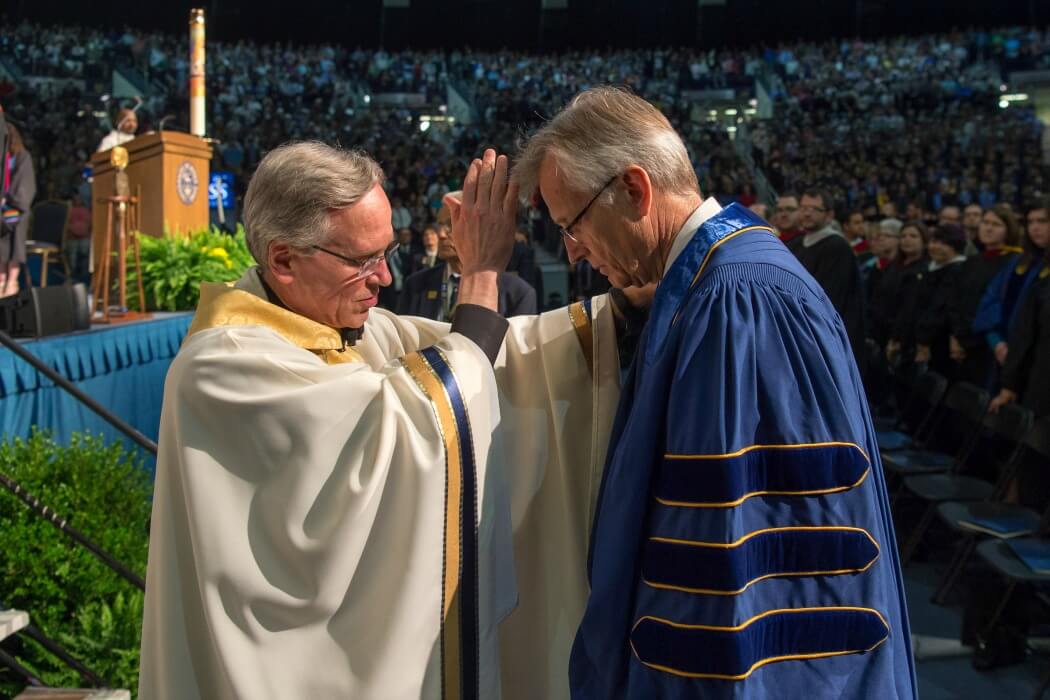 Fr. Jenkins blesses Rev. Junge.