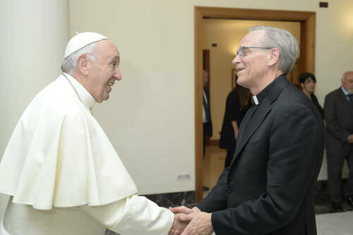 Rev. John I. Jenkins, C.S.C., shakes hands with His Holiness Pope Francis