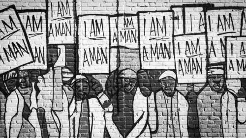 Mural near the National Civil Rights Museum in Memphis TN. The wall is a re-interpretation of a 1960's photo of striking Memphis sanitation workers.