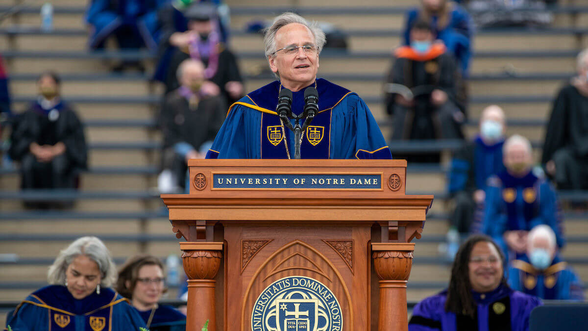 University of Notre Dame President John I. Jenkins, C.S.C., introduces the commencement speaker Jimmy Dunne during the 176th Commencement Ceremony at Notre Dame Stadium. (Photo by Barbara Johnston/University of Notre Dame)