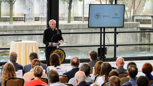 Rev. John I. Jenkins, C.S.C. president of the University of Notre Dame gives remarks at the dedication ceremony for Notre Dame’s hydroelectric project on the St. Joseph river in downtown South Bend. (Photo by Matt Cashore/University of Notre Dame)