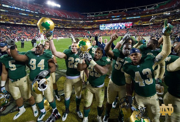Members of the football team stop to sing "Notre Dame, Our Mother" after defeating Maryland  45-21 at FedEx Field