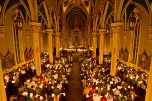 The candle-lighting ceremony at Easter Vigil Mass