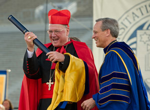 Cardinal Timothy Dolan accepts an honorary degree from Rev