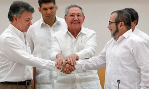 Havana, Cuba. September 23, 2015, President Juan Manuel Santos of Colombia (left in the photo) and the head of the FARC, Comandante Timoschenko (right in the photo) shake hands during a ceremony announcing the first agreement for peace. Never before had a Colombian President and a FARC comandante shaken hands.