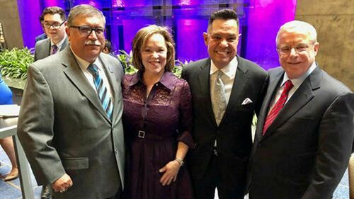 Luis Fraga (second from right), with (from left) ILS Advisory Council member Phil Fuentes; Fraga's wife, Charlene Aguilar; and ILS Advisory Council member Joe Power.
