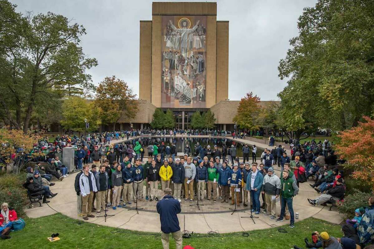 The Notre Dame Glee Club performs on the Library Quad before a football game