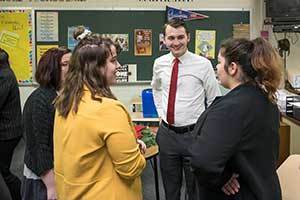 Notre Dame 2L Law Student Henry Leaman talks with members of the Clay High School Mock Trial team during an evening scrimmage at Clay High School. Photo by Matt Cashore/University of Notre Dame.