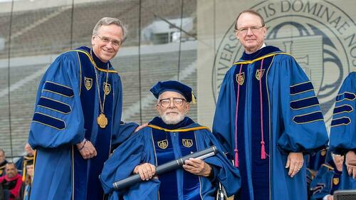 Rev. Thomas F. Stransky, C.S.P. poses for a photo with University of Notre Dame President Rev. John Jenkins, C.S.C. (left) and Notre Dame Board of Trustees Chairman Richard Notebaert after being awarded an honorary doctorate at the 2015 Commencement ceremony. Photo by Matt Cashore/University of Notre Dame.