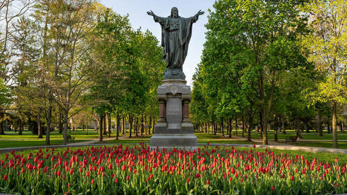 The Sacred Heart of Jesus statue in the Main Quad during spring, 2020. Photo by Barbara Johnston/University of Notre Dame.