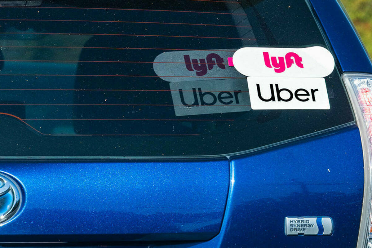 A car driving for Uber and Lyft.