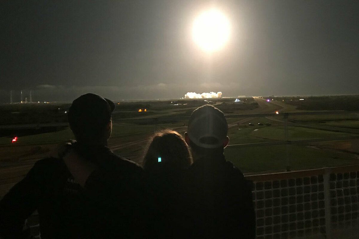 Lucas, Julie and Ryan Hopkins (right to left) watch Mike Hopkins lift off from Launch Complex 39A at the Kennedy Space Center on the evening of Nov. 15.