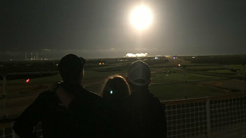 Lucas, Julie and Ryan Hopkins (right to left) watch Mike Hopkins lift off from Launch Complex 39A at the Kennedy Space Center on the evening of Nov. 15.
