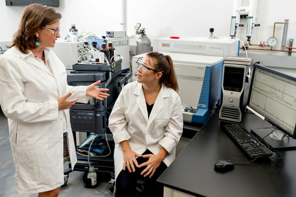 Patricia Clark works with a graduate student in a McCourtney Hall lab. (Photo by Matt Cashore/University of Notre Dame)