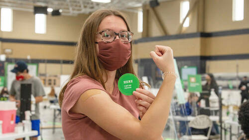 Student Caroline Ashworth after receiving her first injection of the Pfizer COVID-19 vaccine on the first day of the Notre Dame student, faculty and staff vaccine clinic in the Compton Family Ice Arena auxiliary rink. (Photo by Barbara Johnston/University of Notre Dame)