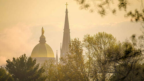 Dome and Basilica at sunrise (Photo by Matt Cashore/University of Notre Dame)