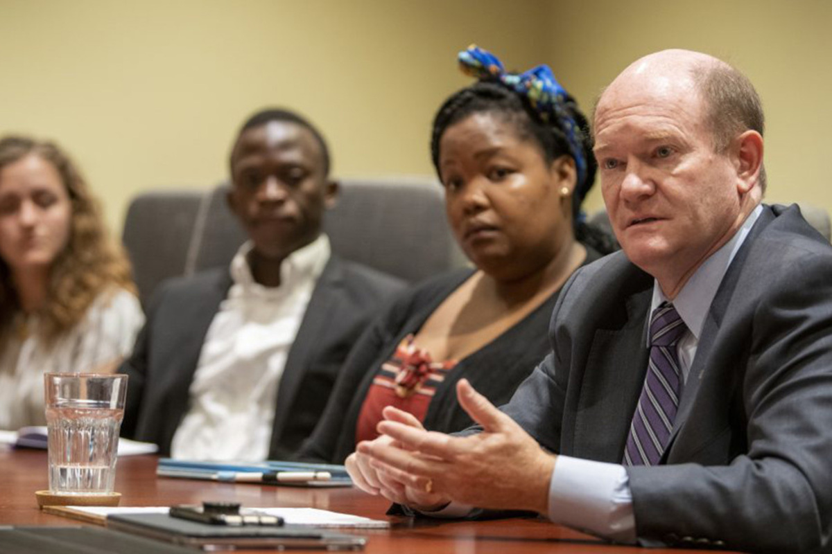 US Senator Chris Coons, a 1983 Truman Scholar, visits with Notre Dame undergraduates at the Keough School of Global Affairs.