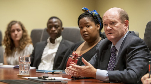 US Senator Chris Coons, a 1983 Truman Scholar, visits with Notre Dame undergraduates at the Keough School of Global Affairs.