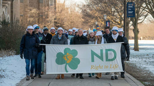 University President Rev. John Jenkins, C.S.C., marches with students on South Quad during the March for Life event on campus. The Notre Dame March For Life 2022 took place on campus with a Mass at the Basilica of the Sacred Heart.  (Photo by Barbara Johnston/University of Notre Dame)