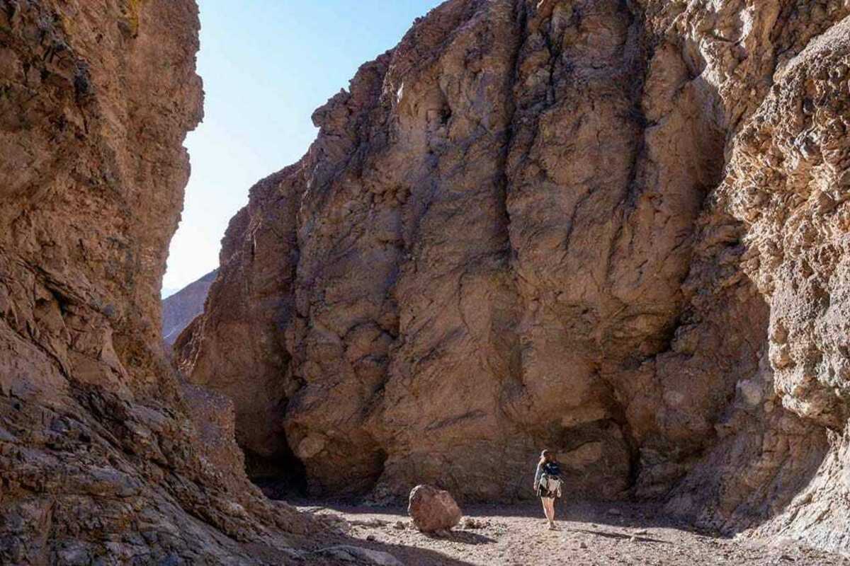 A Civil and Environmental Engineering and Earth Sciences student hikes through Natural Bridge Canyon in Death Valley National Park.
