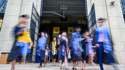 Graduates exit Notre Dame Stadium following the College of Arts & Letters diploma ceremony, Commencement 2021. (Photo by Matt Cashore/University of Notre Dame)