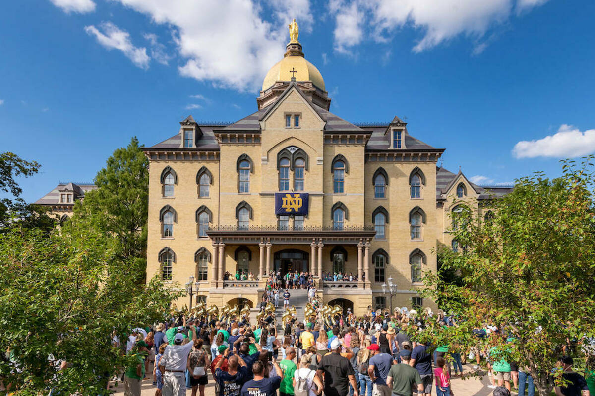 The Notre Dame Marching band marches out to rehearsal from the front steps of the Main Building.(Photo by Barbara Johnston/University of Notre Dame)