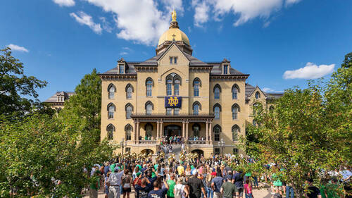 The Notre Dame Marching band marches out to rehearsal from the front steps of the Main Building.(Photo by Barbara Johnston/University of Notre Dame)