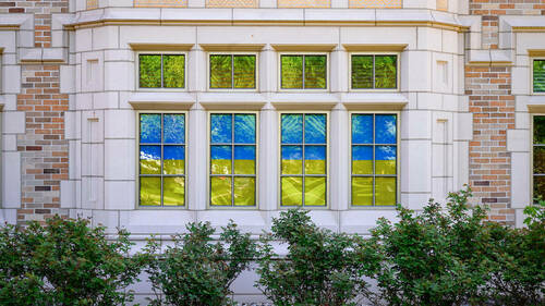 Windows of the Nanovic Institute in Jenkins-Nanovic Hall are covered in the colors of the Ukrainian flag. (Photo by Matt Cashore/University of Notre Dame)