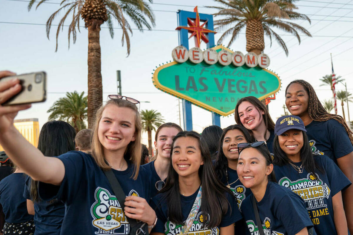 Members of the Notre Dame Marching Band Piccolo section take a selfie in front of the famous Las Vegas sign while in Las Vegas for the 2022 Shamrock Series game. (photo by Matt Cashore/University of Notre Dame)