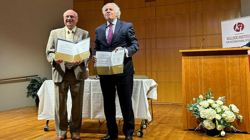 From left, Scott Appleby, Marilyn Keough Dean of the University of Notre Dame’s Keough School of Global Affairs, and Organization of American States Secretary General Luis Almagro celebrate the announcement of a new partnership to protect human rights and democracy.