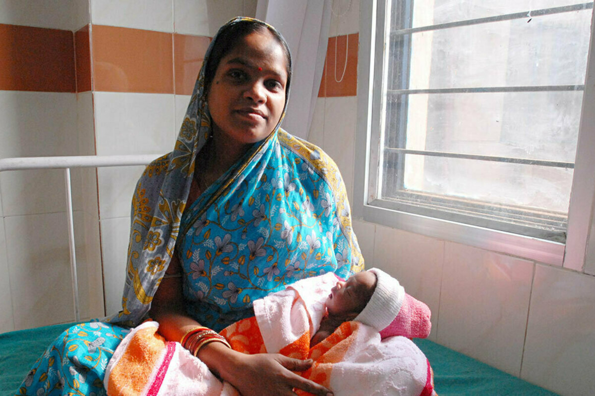 A mother and her newborn child are pictured in Odisha, India. Photo by Pippa Ranger via Flickr.