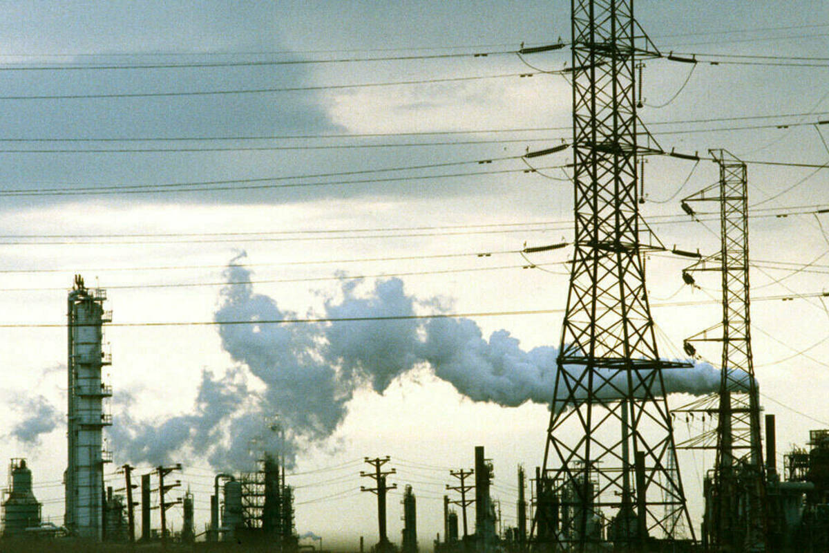 A factory smokestack in New Jersey emits pollutants into the atmosphere.