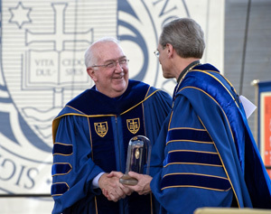 Ken Hackett receives Laetare Medal from University President Rev. John I. Jenkins, C.S.C.